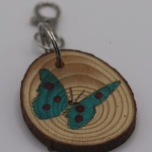 A blue spotted butterfly keyring