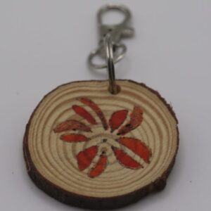 A handmade red flower keyring