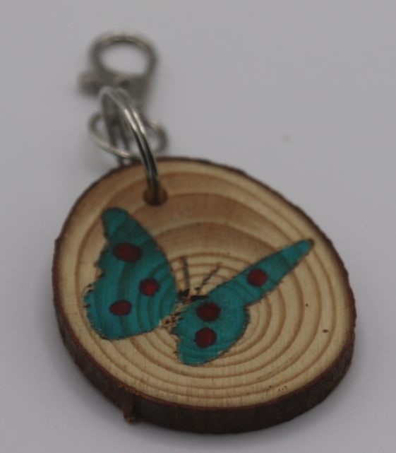 A blue spotted butterfly keyring