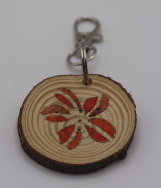 A handmade red flower keyring