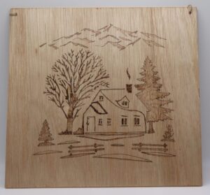 a cottage scene pyrography style 29cm square £18-00