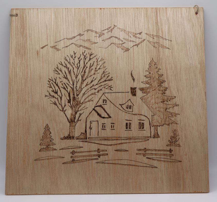 a cottage scene pyrography style 29cm square £18-00
