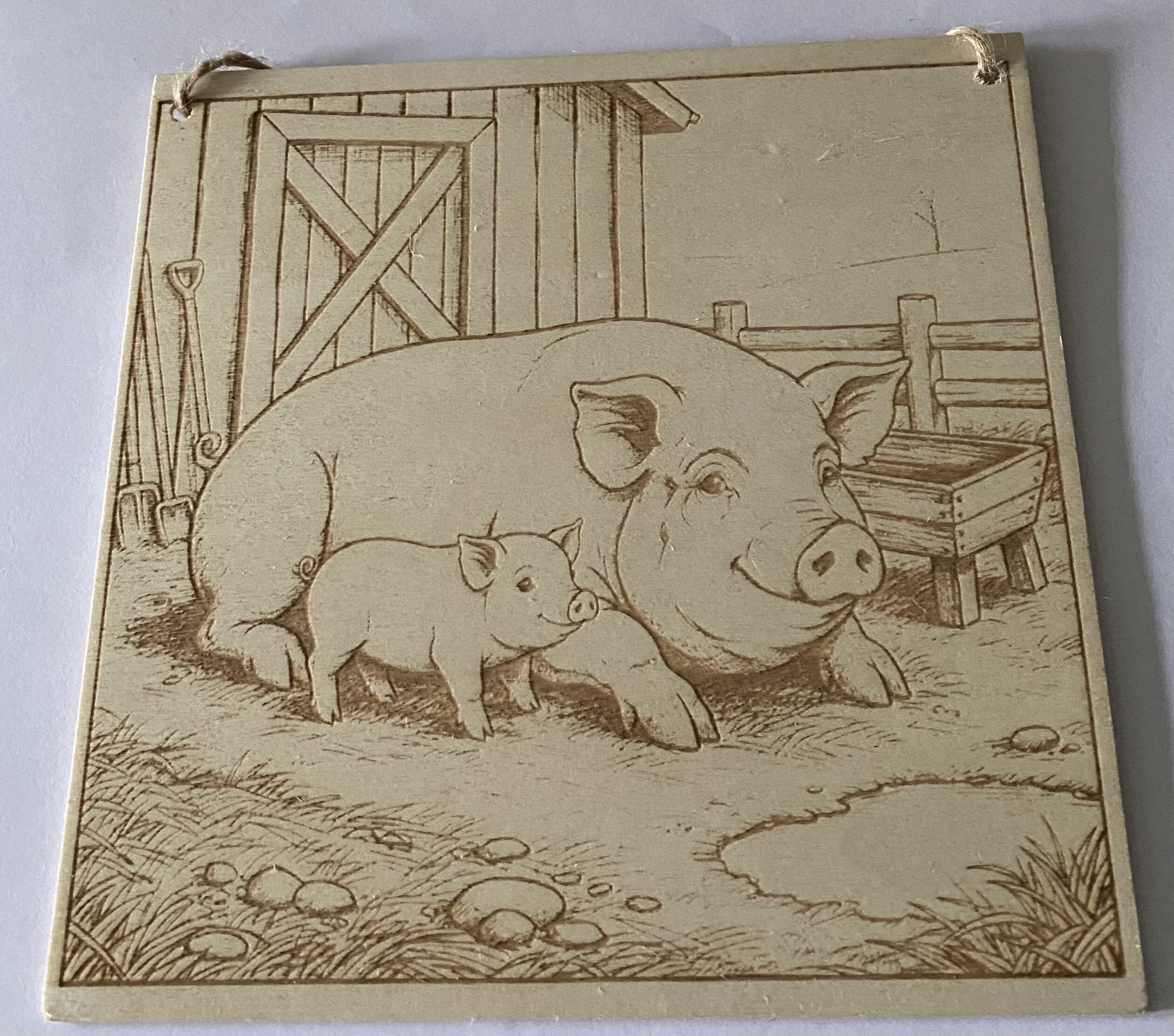 A plaque of a large and small pig