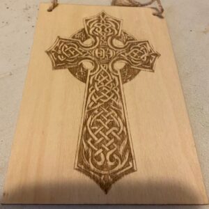 A plaque with a celtic cross on it