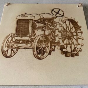 A old tractor engraved on a plaque