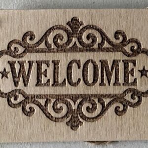 A plaque with welcome on it