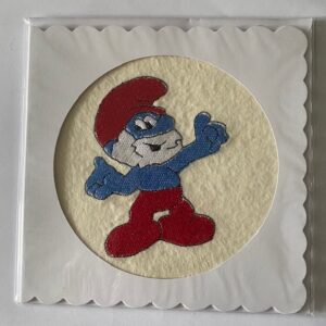 A card with a smurf on it