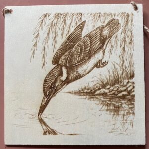 A plaque with a king fisher on it