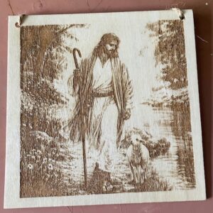 A plaque of a man and sheep