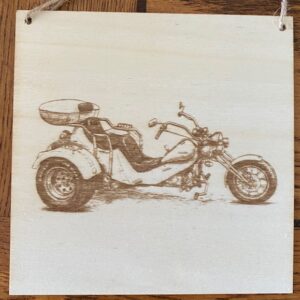 A PLAQUE OF A TRIKE MOTORBIKE